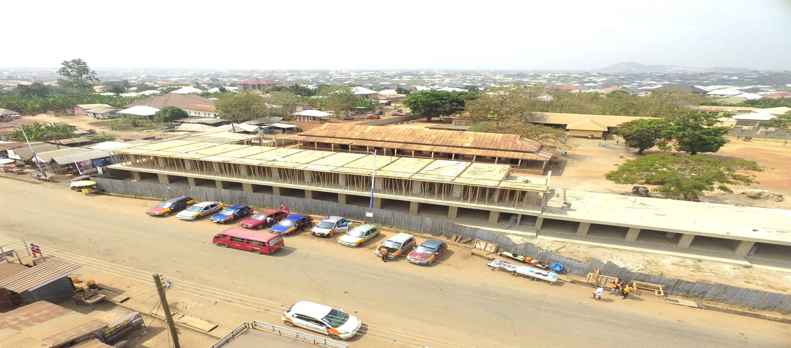 Construction of Modern Lockable Stores, Apartment and Social Centre at Maase