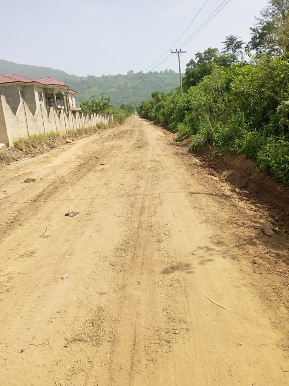 Reshaping of Nkosec-Tayi and Nkonya Tayi Road (1.4KM)