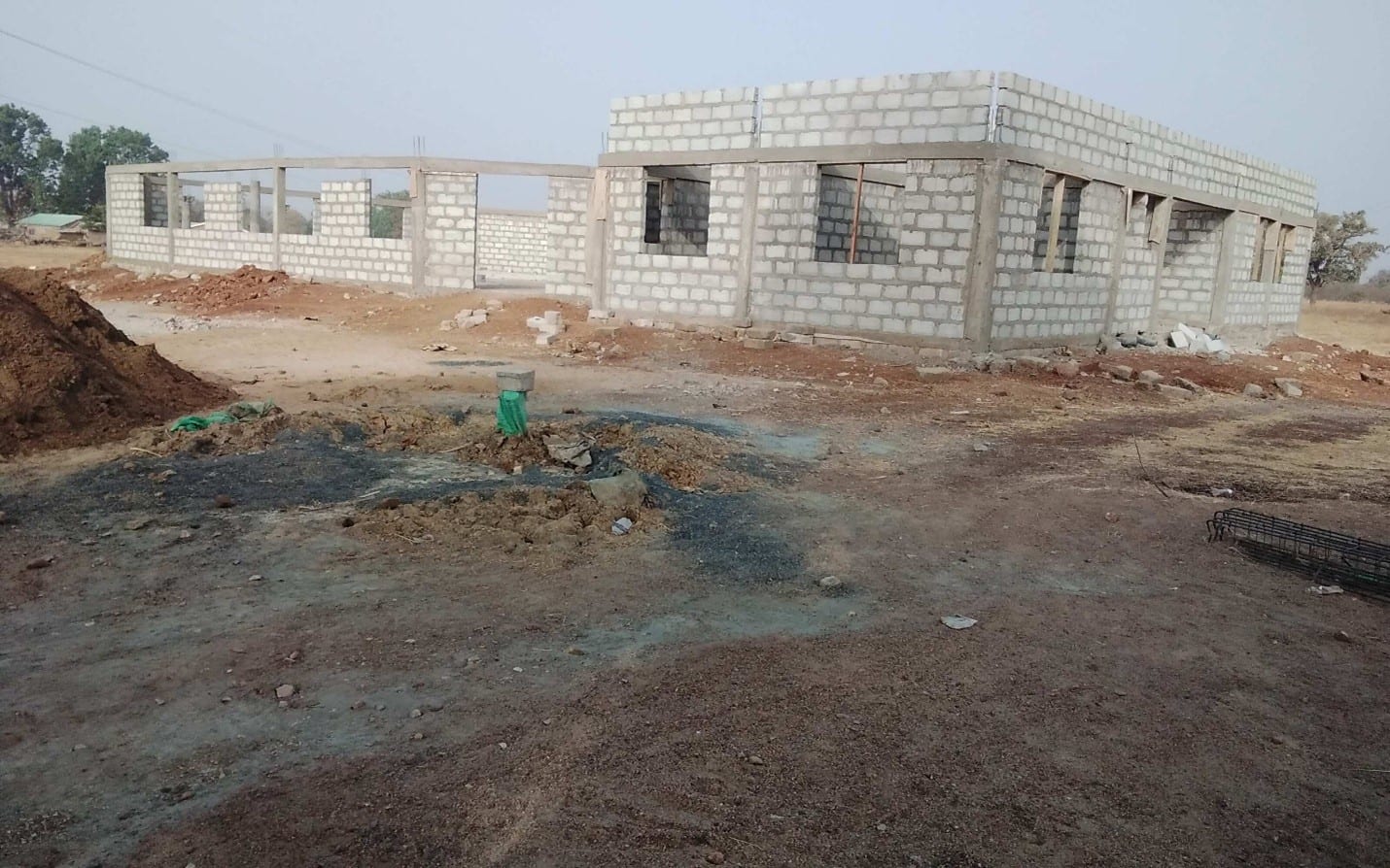 Construction of community center with a hall, store, an office and unit 2-bath and toilet each at Asonge.